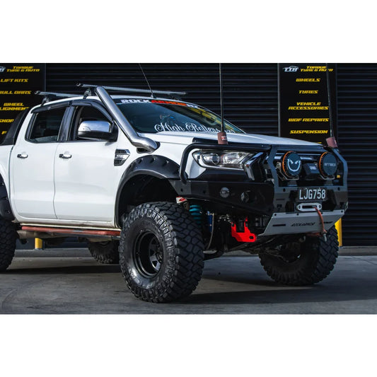 Modified white pickup truck with Rockarmor GT Steel Hoop Bullbar and driving lights