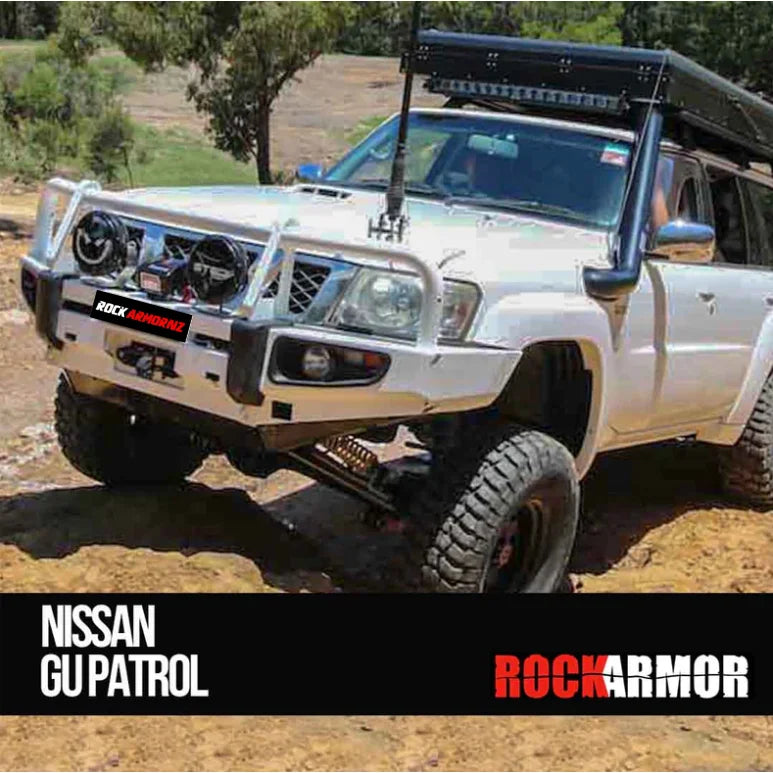 White Nissan GU Patrol off-road vehicle with Rockarmor premium steel bullbar and fog lights