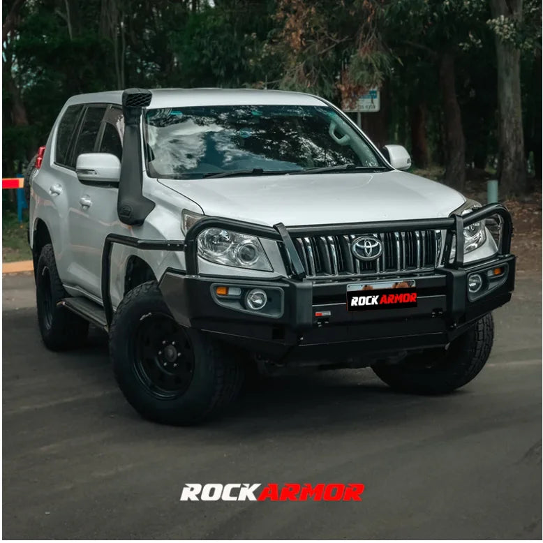 Silver off-road Toyota SUV with Rockarmor premium steel bullbar and fog lights