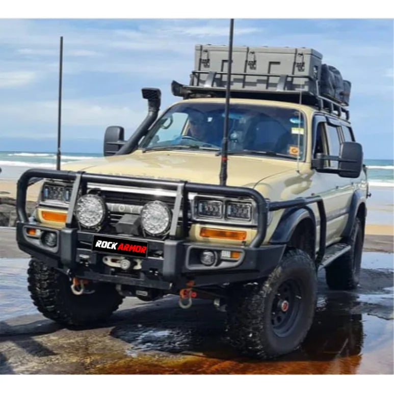 Modified tan Toyota Land Cruiser with Rockarmr steel bullbar and fog lights installation
