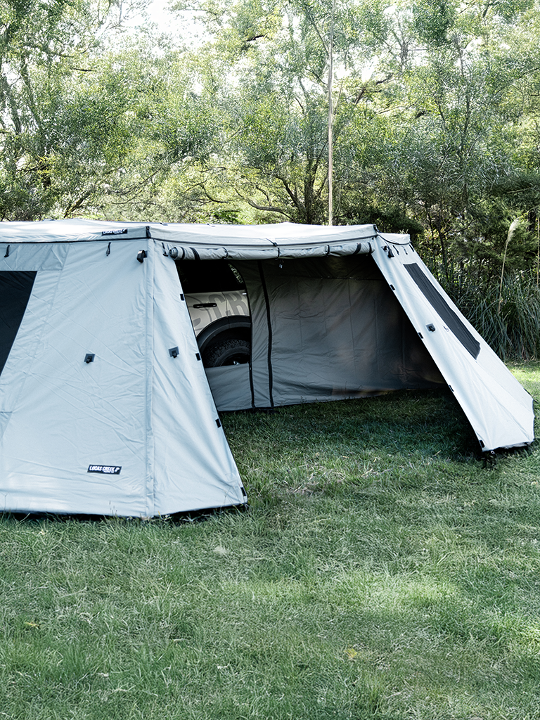 Close up view of the Lucas Creek  180 Fantail free standing awning with the outer and inner wall kit installed  and one door fully open to see inside 