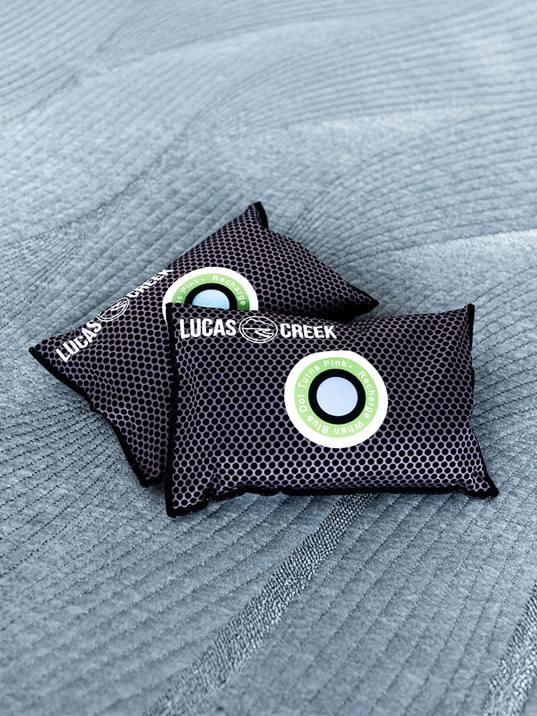 Two reusable anti condensation bags sitting in a tent 