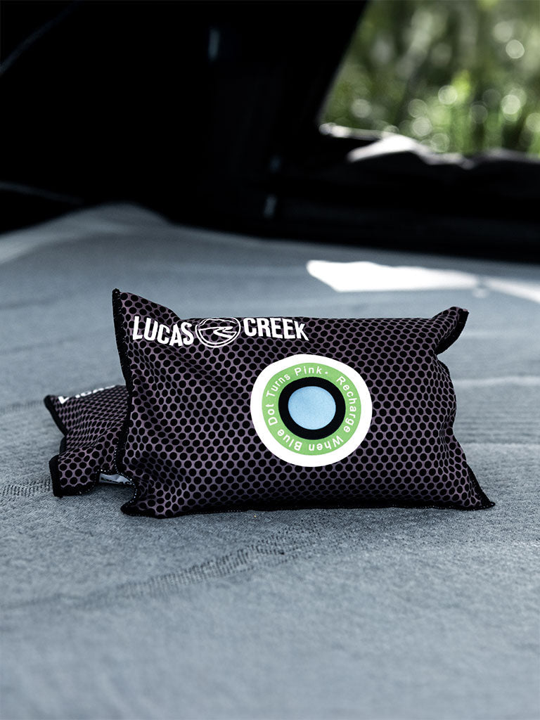 Two reusable anti condensation bags sitting in a tent 