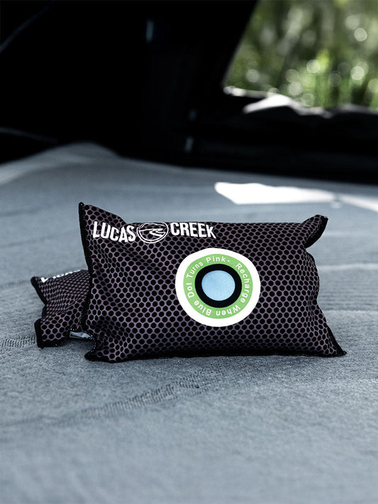 Two reusable anti condensation bags sitting in a tent 